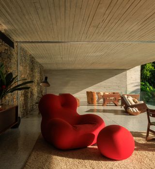 ‘Up 5’ armchair and pouf by Gaetano Pesce. Conical seats by Hugo França. Wooden armchair by Carlos Motta