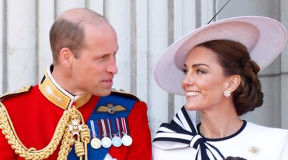 Prince William, Prince of Wales (Colonel of the Welsh Guards) and Catherine, Princess of Wales watch an RAF flypast from the balcony of Buckingham Palace after attending Trooping the Colour on June 15, 2024 in London, England. 