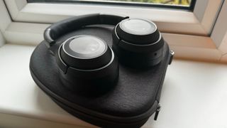SoundMagic P60BT on top of the carrying case