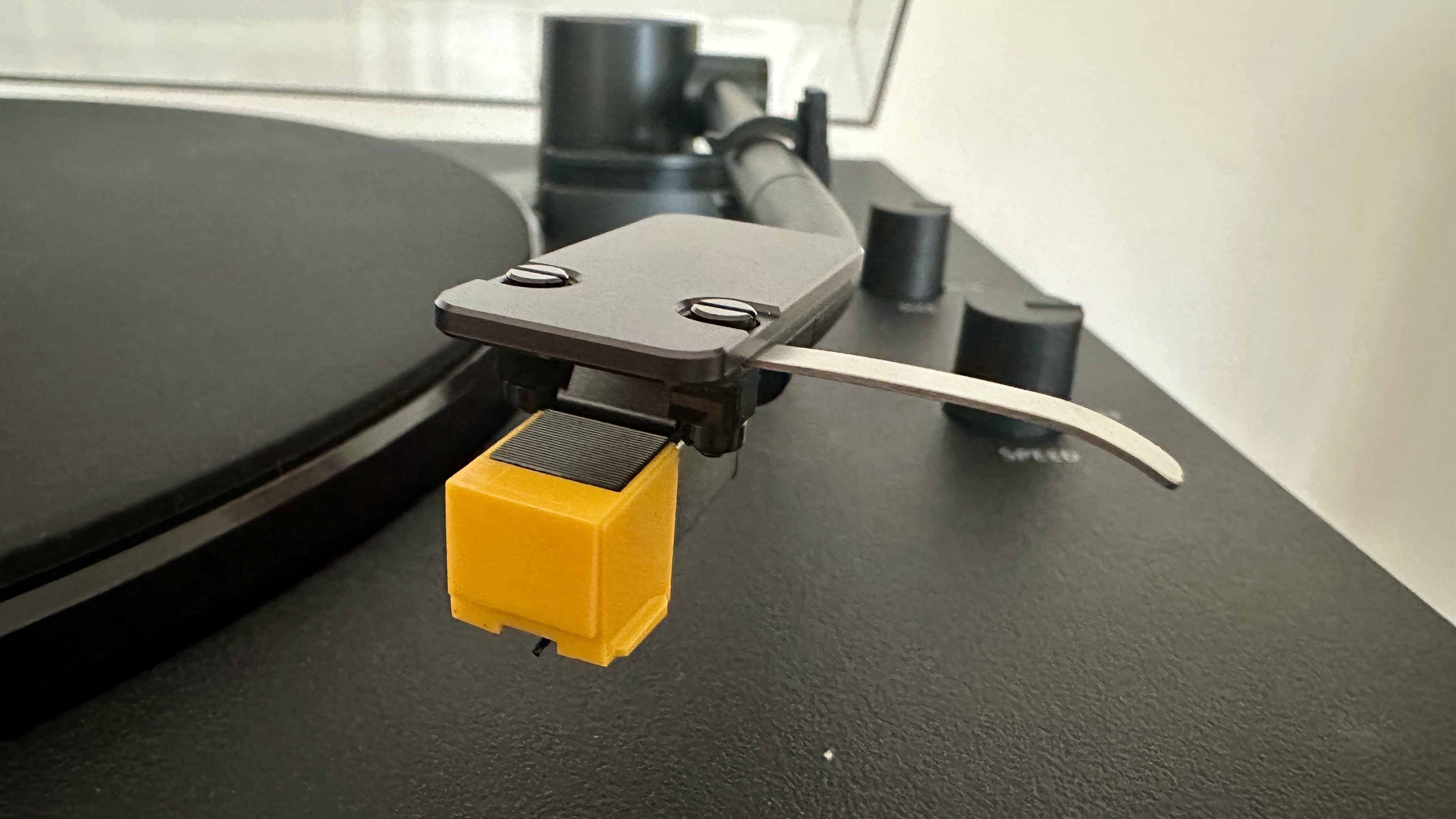 Sony PS-LX510BT turntable on a brown wood hi-fi rack, with closeups