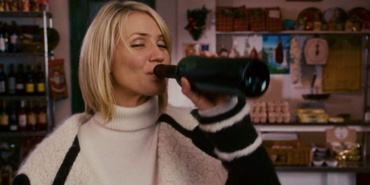 Amanda (Cameron Diaz) drinks straight from a red wine bottle in &#039;The Holiday&#039;