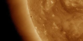 An image of Mercury's transit of the sun on May 9, 2016, as seen by NASA's Solar Dynamics Observatory. The image shows the sun in extreme ultraviolet light.