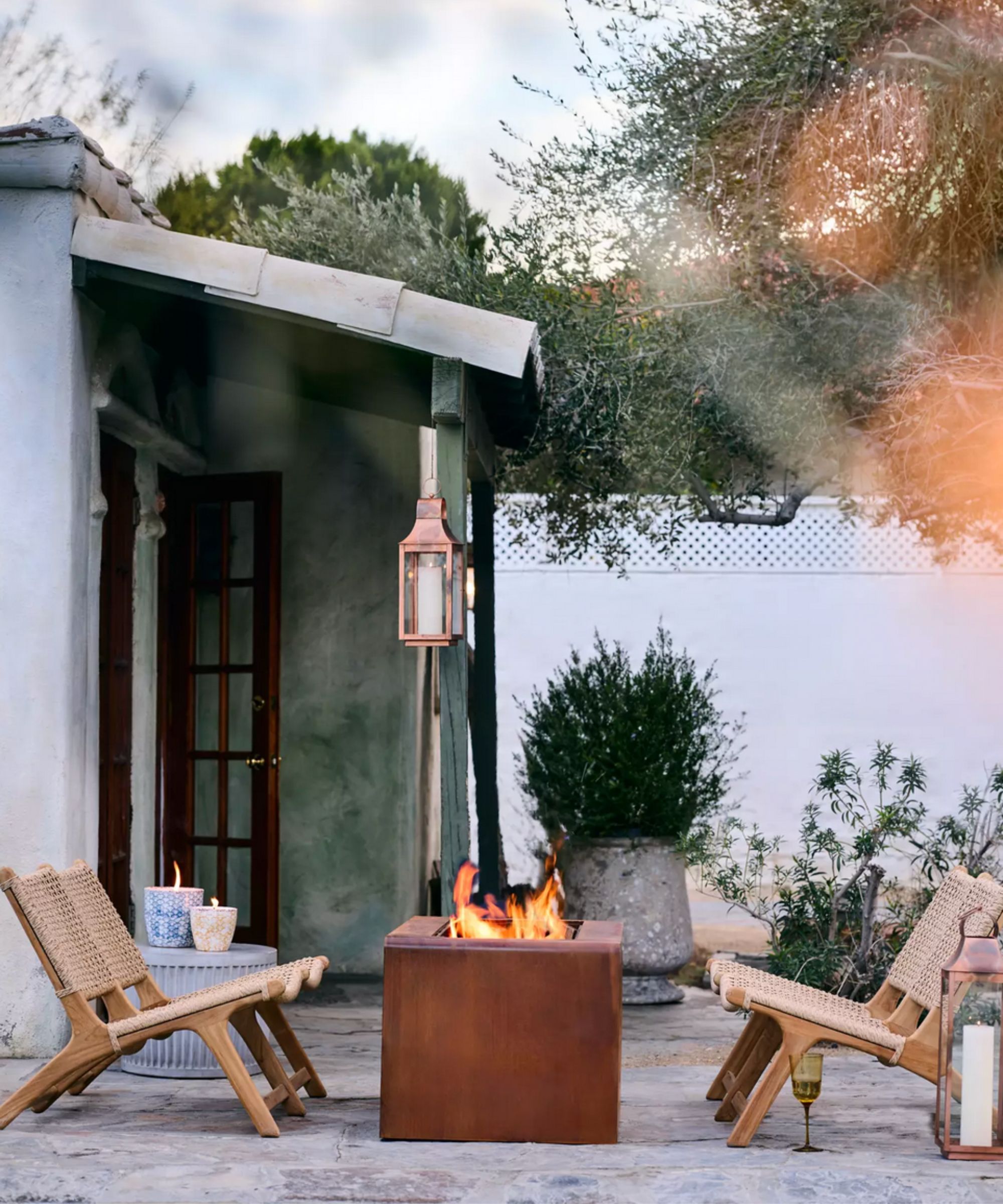 Backyard with chairs around a firepit