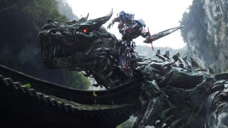 Optimus Prime rides Grimlock in Transformers: Age of Extinction