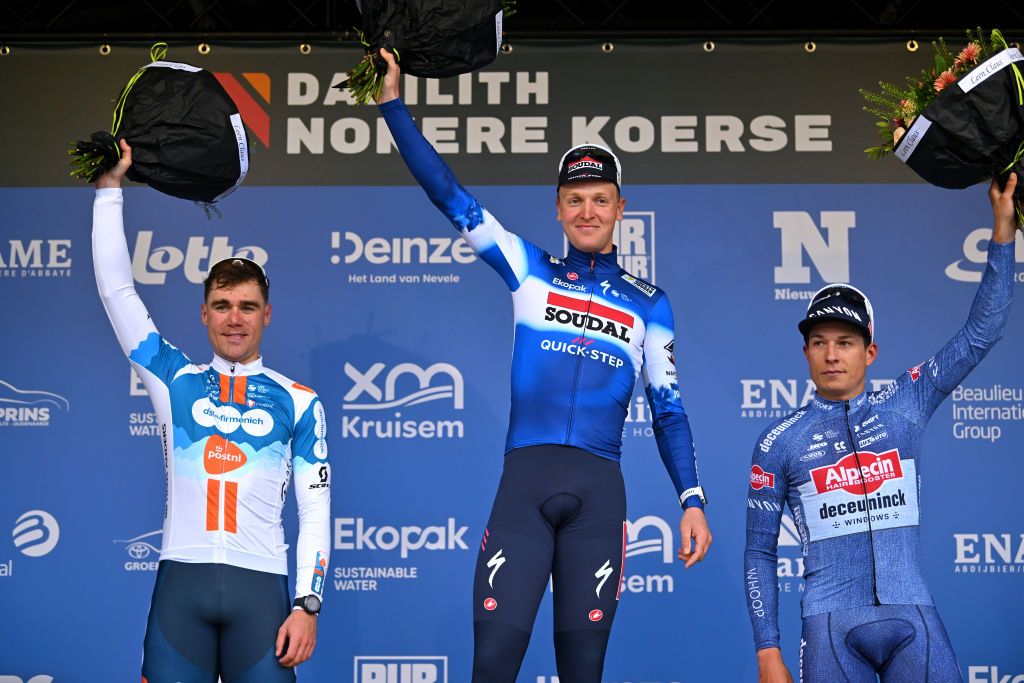 NOKERE BELGIUM MARCH 13 LR Fabio Jakobsen of The Netherlands and Team dsmfirmenich PostNL on second place race winner Tim Merlier of Belgium and Team Soudal QuickStep and Jasper Philipsen of Belgium and Team Alpecin Deceuninck on third place pose on the podium ceremony after the 78th Danilith Nokere Koerse 2024 Mens Elite a 1881km one day race from Deinze to Nokere UCIWT on March 13 2024 in Nokere Belgium Photo by Luc ClaessenGetty Images