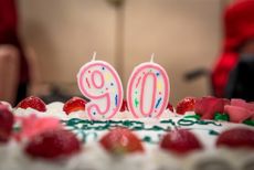 90th birthday candles on a cake