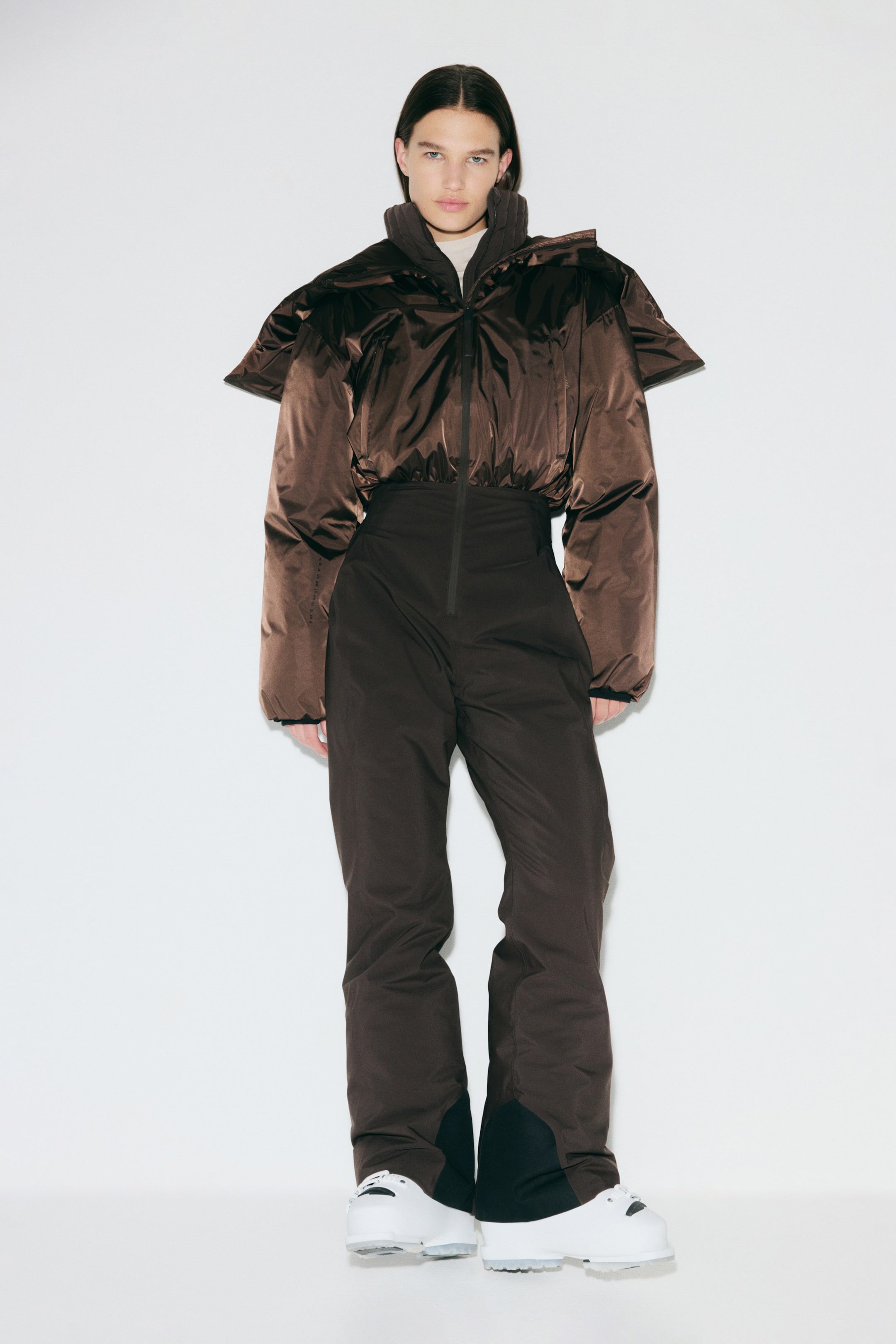 a model wearing a brown H&amp;amp;M ski suit