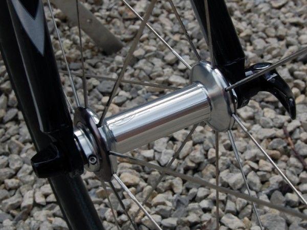 Zipp attach their new 303 rims to their newest set of hubs which now have threaded outer collars for easy bearing adjustments.