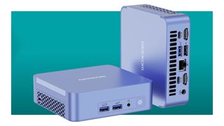 Two Geekom AX8 Pro mini PCs against a teal background with a white border