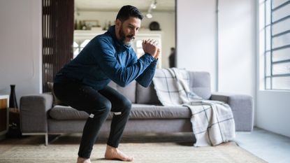 Man doing a home workout in his living room