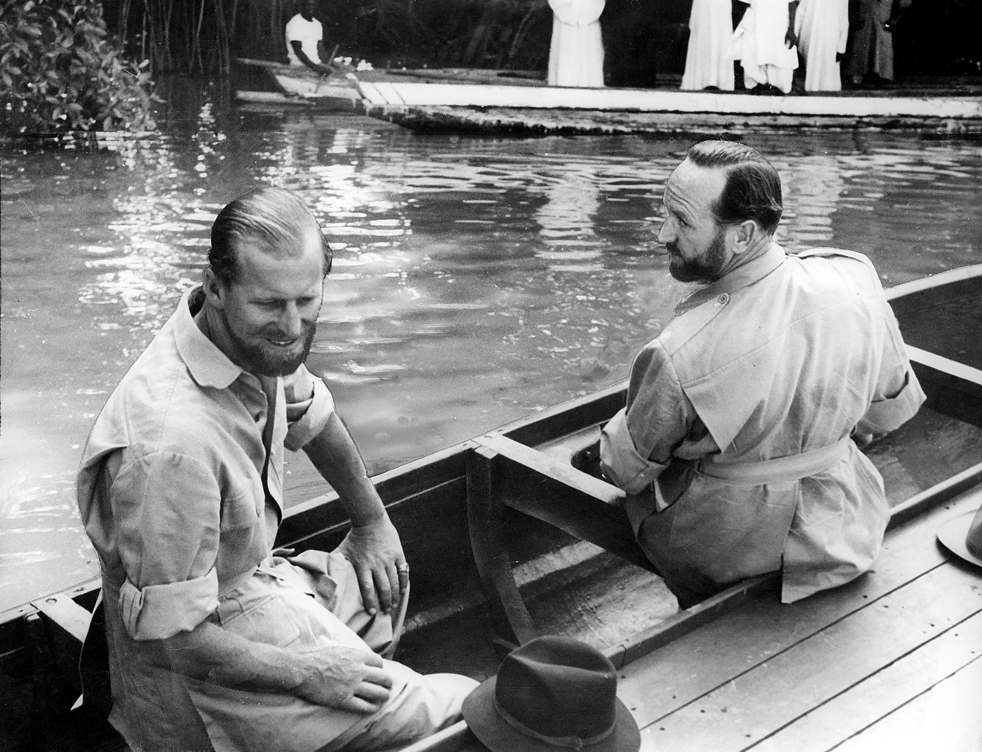 Prince Philip and Mike Parker sitting in a boat