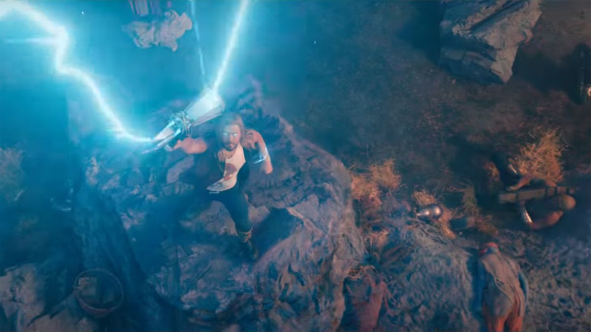 Thor calls down his lightning powers while Drax looks on in Thor: Love and Thunder