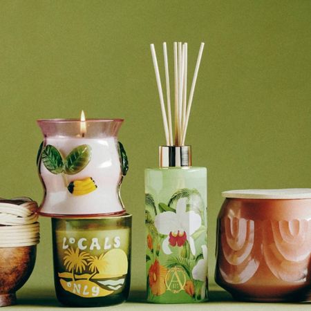 Photo of Anthropologie candles and diffusers on green background