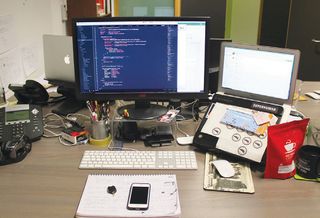 Here is Adam's desk, complete with Bean Coffee and fffunction stickers