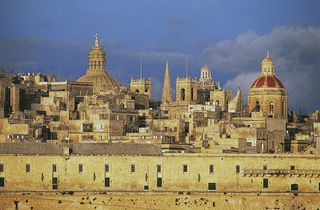 View of Valletta, with the Holy infirmary or Hospital of the Knights of Malta, 1574, in the foreground, Malta. Photo by DeAgostini/Getty Images.