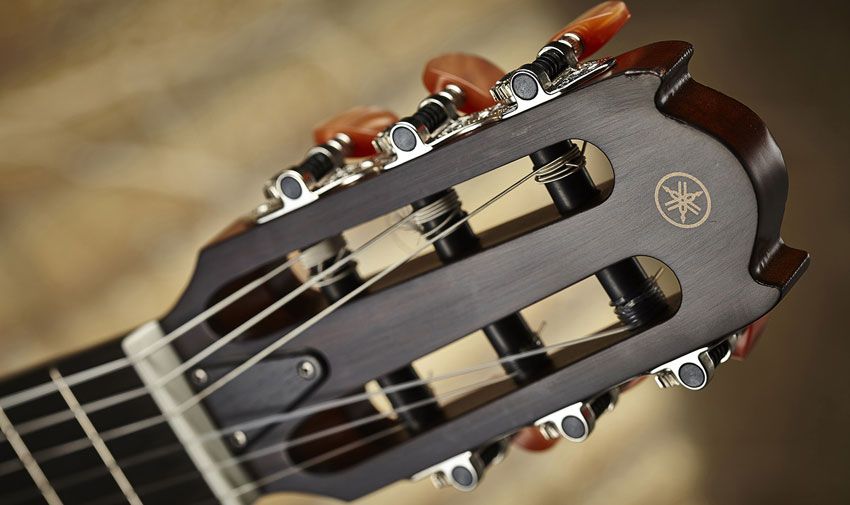 The classical-style tuners have a marble-like finish on the buttons