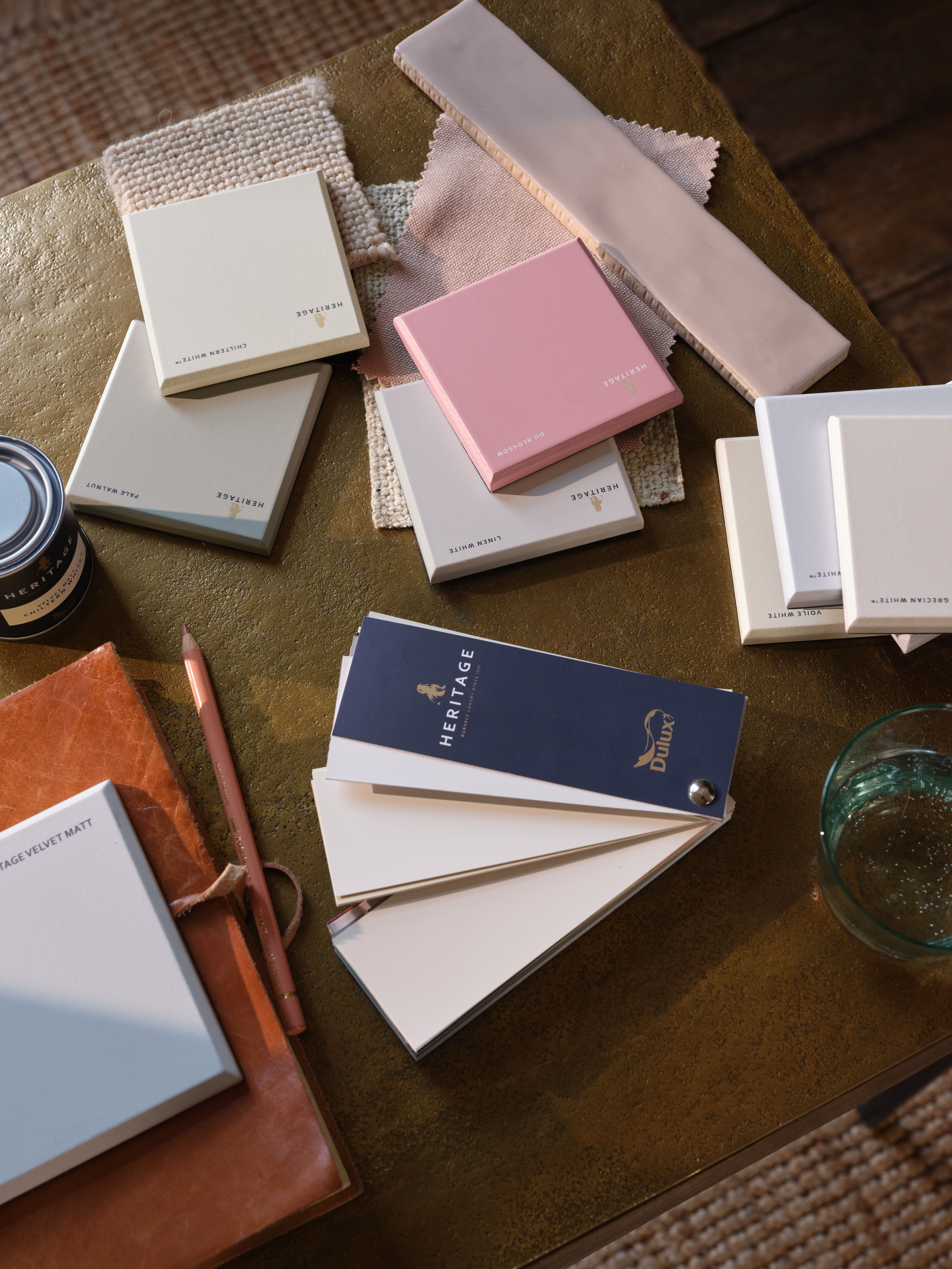 samples of dulux paint colors on a table top
