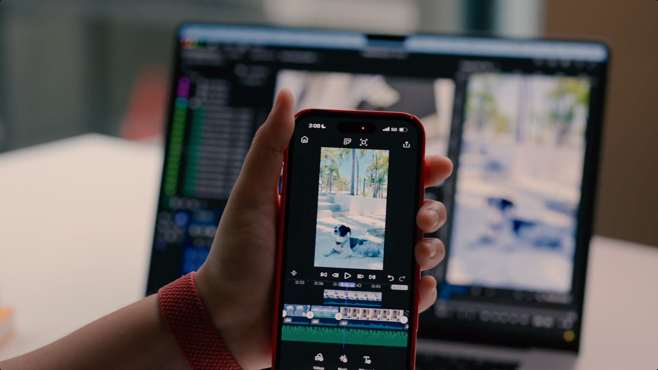 A person uses Adobe Premiere on an iPhone