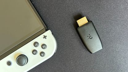 Genki ShadowCast on a black matte background with Nintendo Switch in the corner