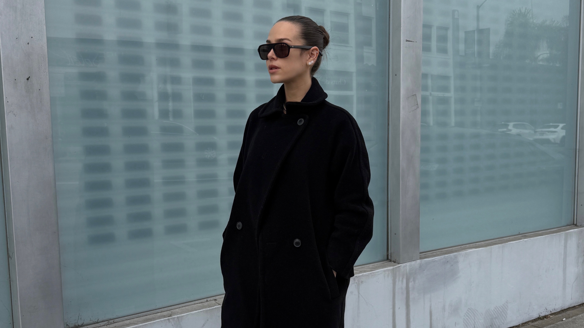 Kira Mackenzie Jackson wearing a black Max Mara coat