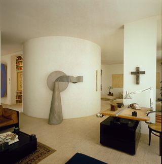 Image inside Max Gordon's home 120 mount street showing a large circular pillar, a chest and pieces of art