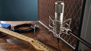Electric guitar, microphone and guitar amp