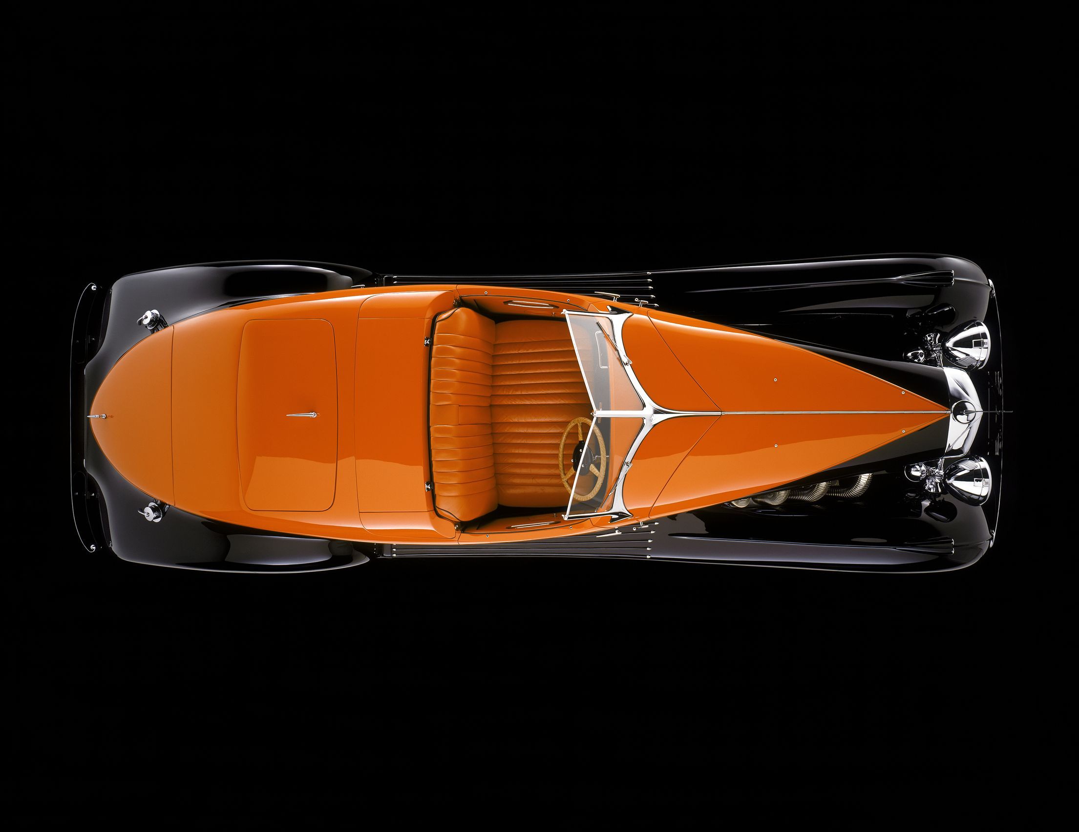 Details of the orange and black Duesenberg. it looks like something Al Capone would drive