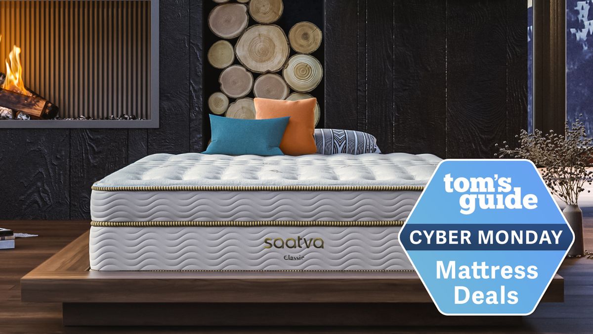 Saatva Classic mattress sits next to an open fire, there is a cyber monday deal stamp in the corner of the image