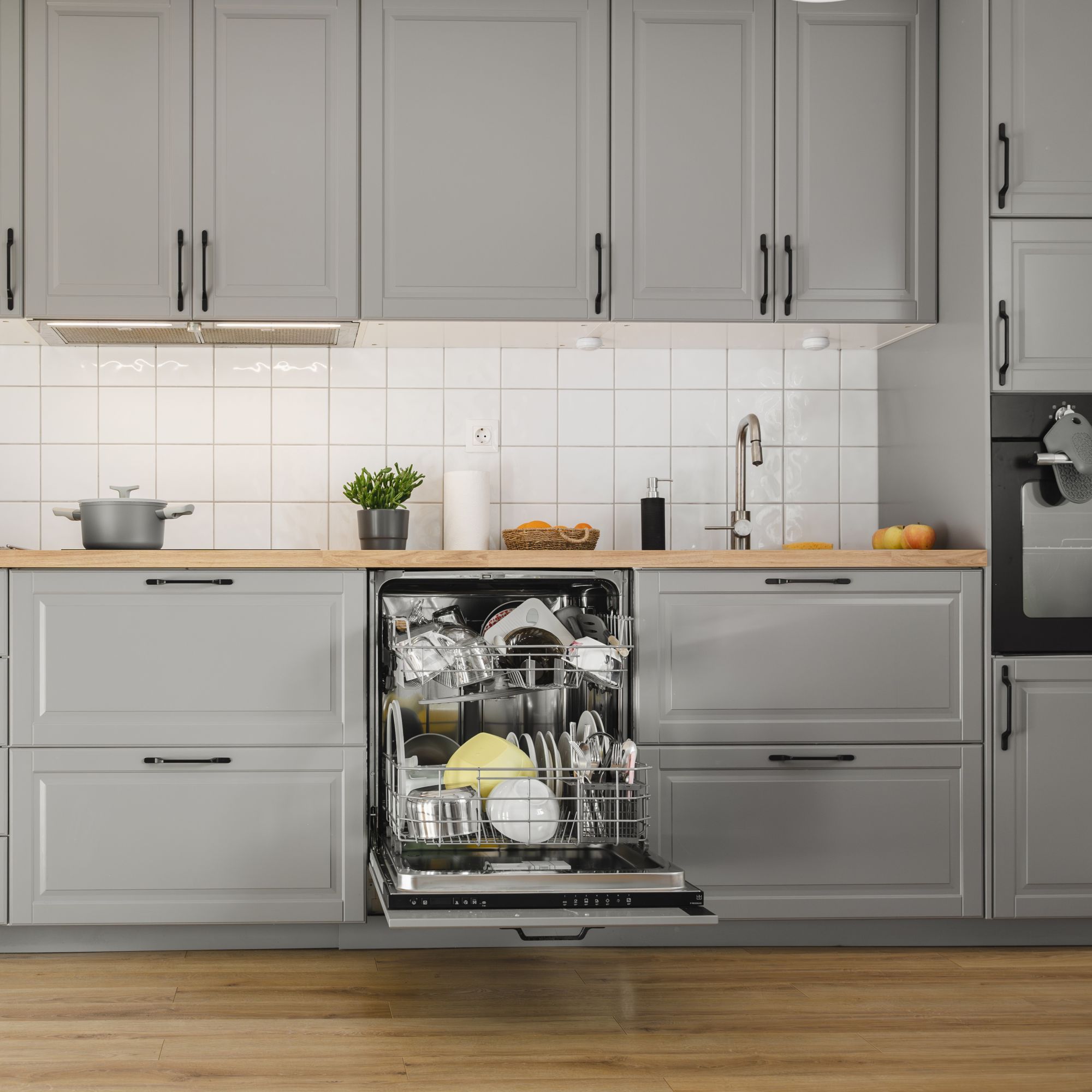 Grey kitchen with dishwasher door open