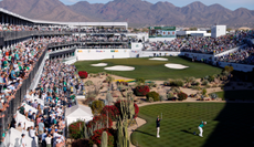 Hideki Matsuyama hits a chip shot at the 16th hole of the WM Phoenix Open