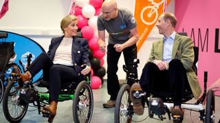 Sophie Wessex and Prince Andrew laughing as they prepare to take part in an adaptive recumbent tricycle race