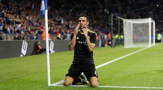 Cesc Fabregas scores against Leicester