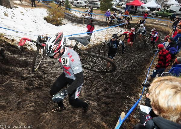 Racers shoulder their bikes on one of the run-ups.