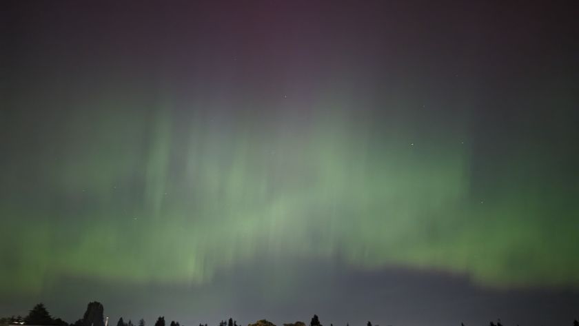 A photo of the northern lights in the night sky