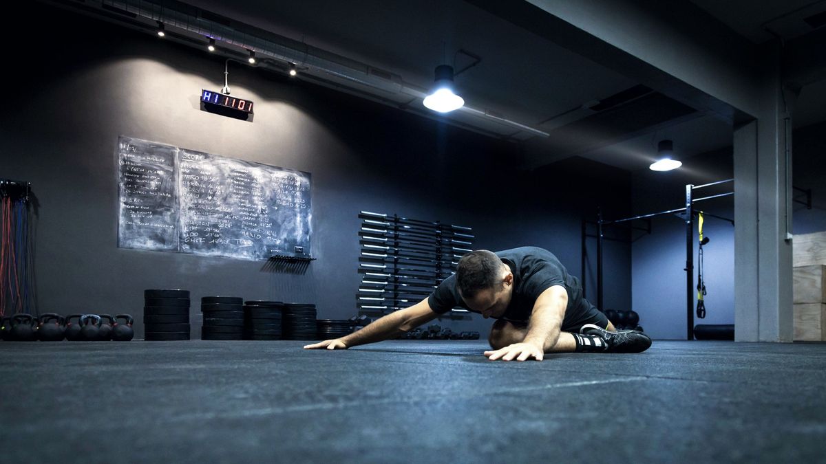 Man performs pigeon pose