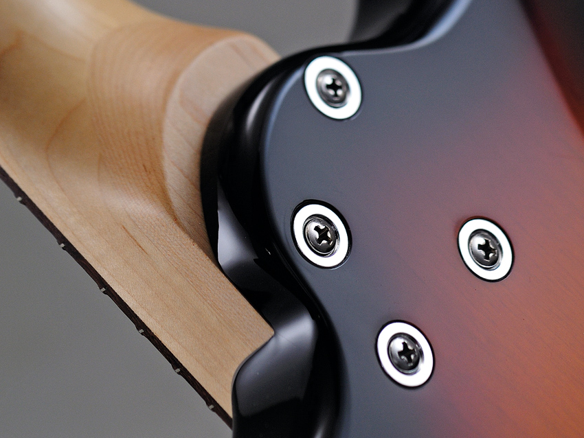 The Corona's offset-bolt join aids upper-fret access.