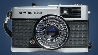 The Olympus Trip 35 on a blue background