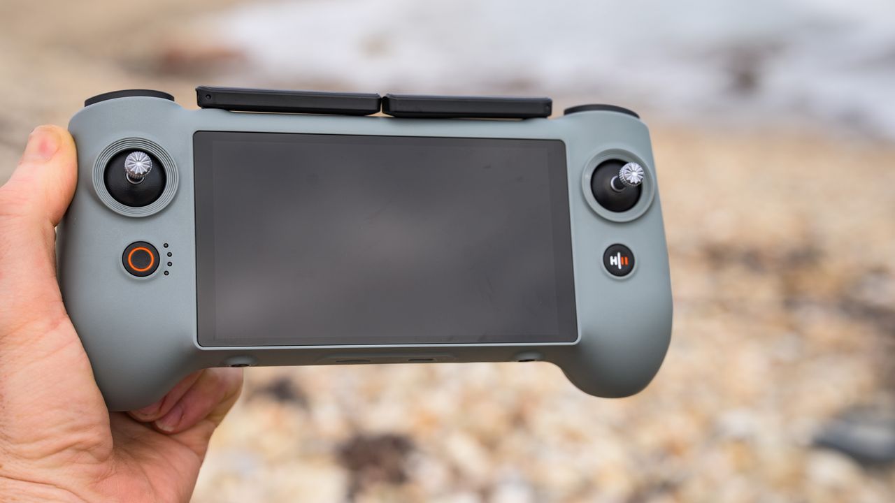 Potensic Atom 3 beginner drone's touchscreen controller in user's hand