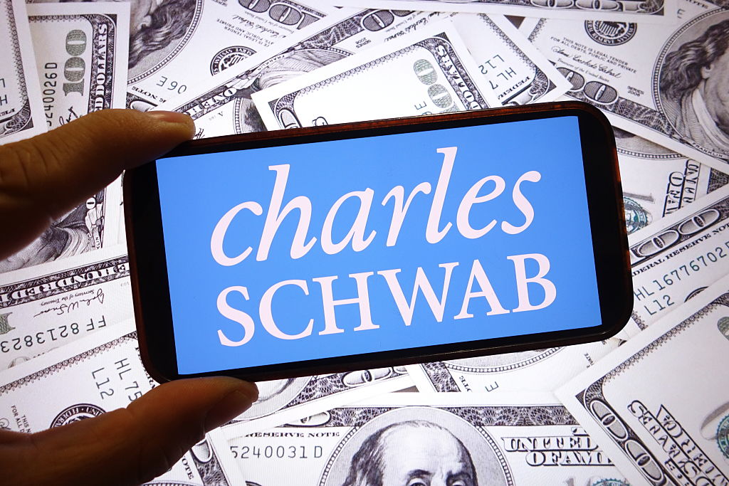 Charles Schwab company logo displayed on a smartphone screen.