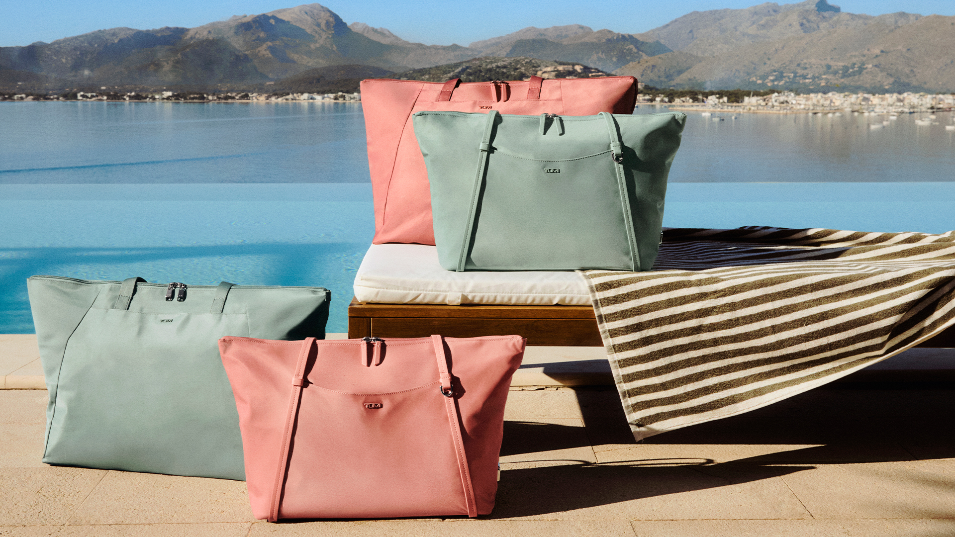 TUMI bags in pink and blue