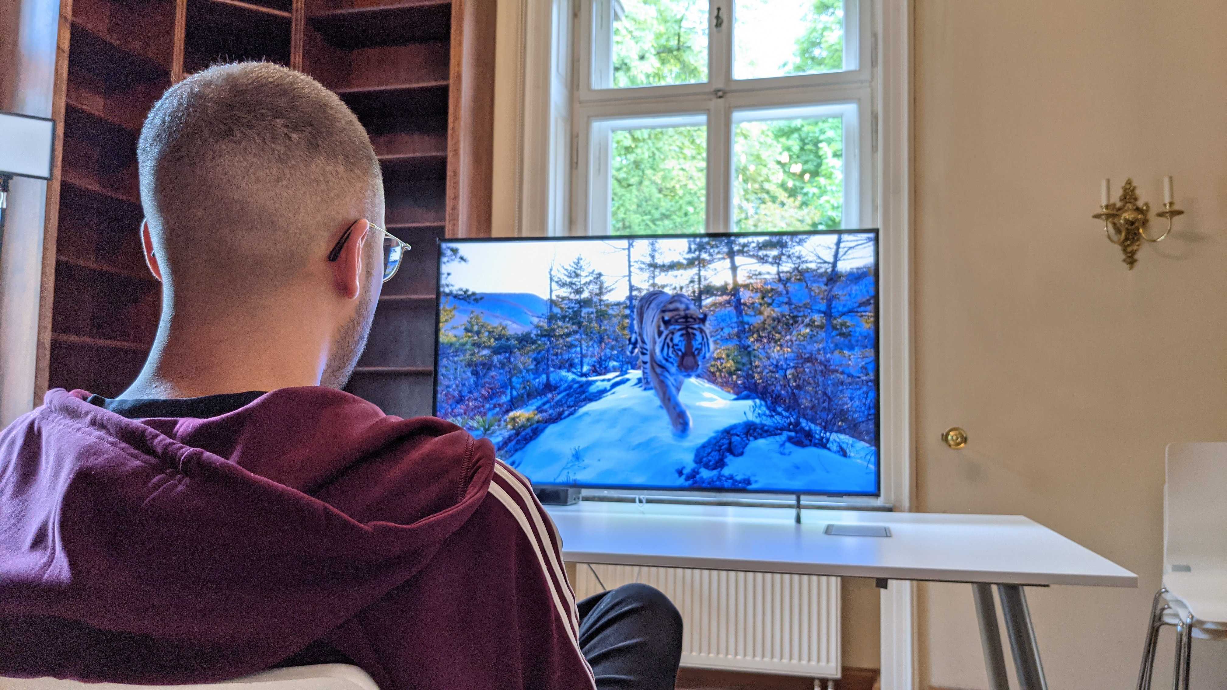 Stephan sitting in front of The Frame 2021 watching Netflix