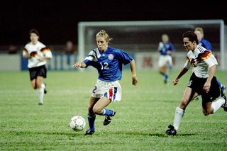 American striker Carin Jennings (12) dribbles up the pitch during semi-final match against Germany in Guangzhou stadium on November 27, 1991, at first FIFA World Championship for Women's Football. The US won the championship by beating Norway 2-1 on November 30. The FIFA Women's World Cup is recognized as the most important International competition in women's football and is played amongst women's national football teams of the member states of FIFA. Contested every four years, the first Women's World Cup tournament, named the Women's World Championship, was held in 1991, sixty-one years after the men's first FIFA World Cup tournament in 1930. AFP PHOTO TOMMY CHENG (Photo credit should read TOMMY CHENG/AFP via Getty Images)