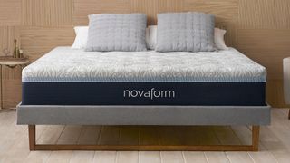 A Novaform mattress in a wll-lit bedroom