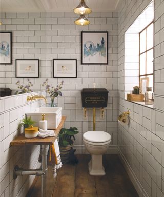 white tiled bathroom with toilet