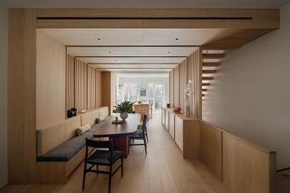 A wooden floor in an open plan living and dining area
