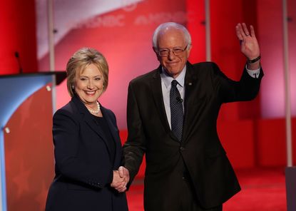Hillary Clinton and Bernie Sanders on stage