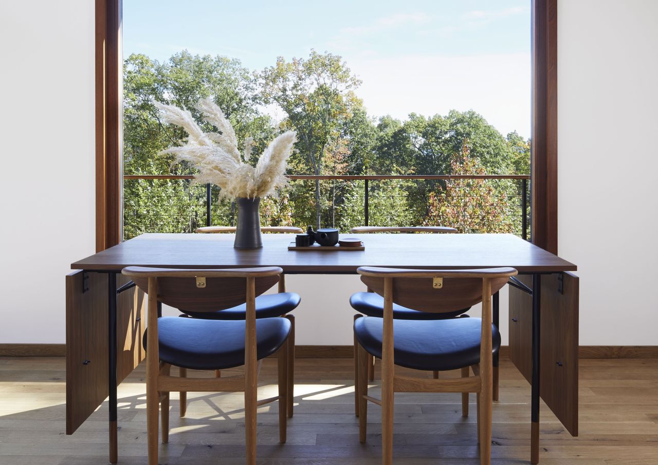 A small dining room with a folding table