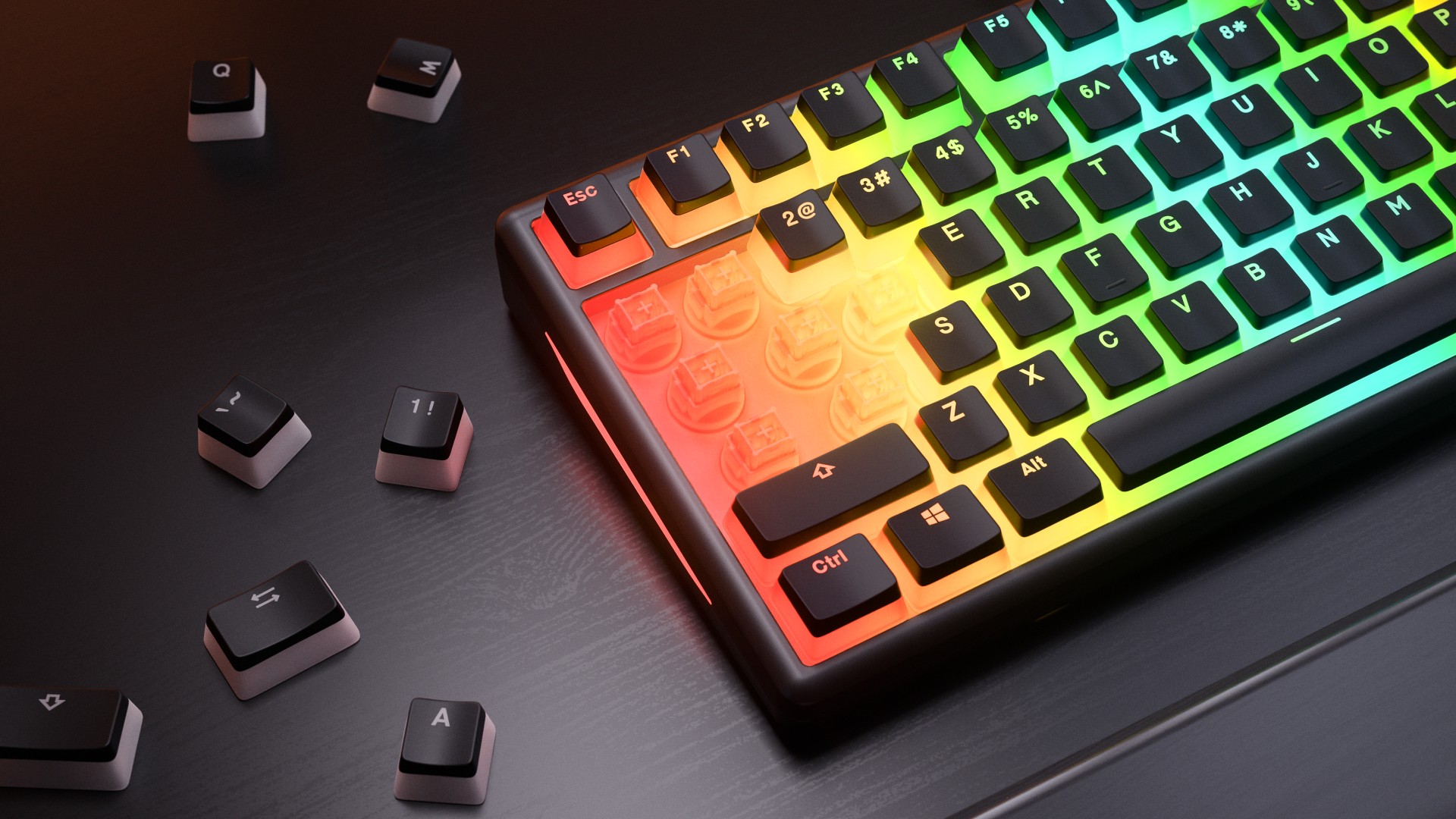 Glorious GMBK 75% gaming keyboard on a black desk with keycaps removed from stems