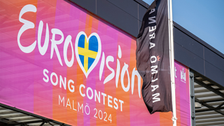 A picture taken on April 25, 2024 shows A Eurovision banner hangs outside Malmo Arena, the venue where the Eurovision song contest (ESC) will take place in Malmo, Sweden. 
