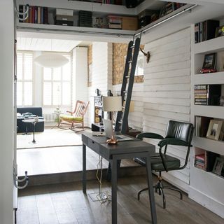 study room with white wall and desk